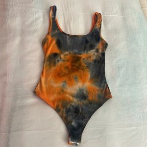 Orange and black tie dye bodysuit